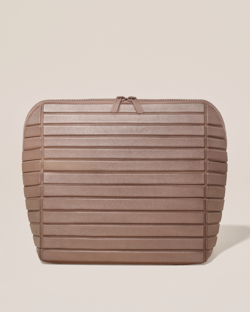 Closed Parallelle Large Bronze Traveller makeup bag with structured horizontal bar design