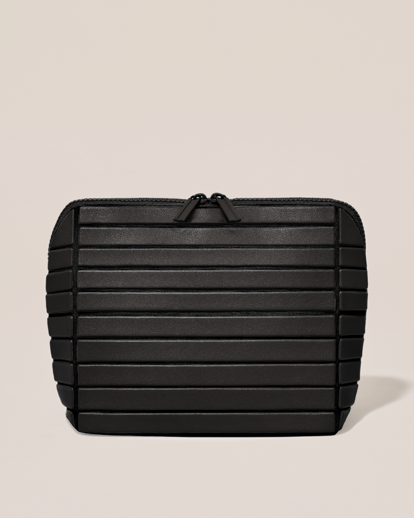 Closed Parallelle Medium Onyx (slate) Traveller makeup bag with structured horizontal bar design