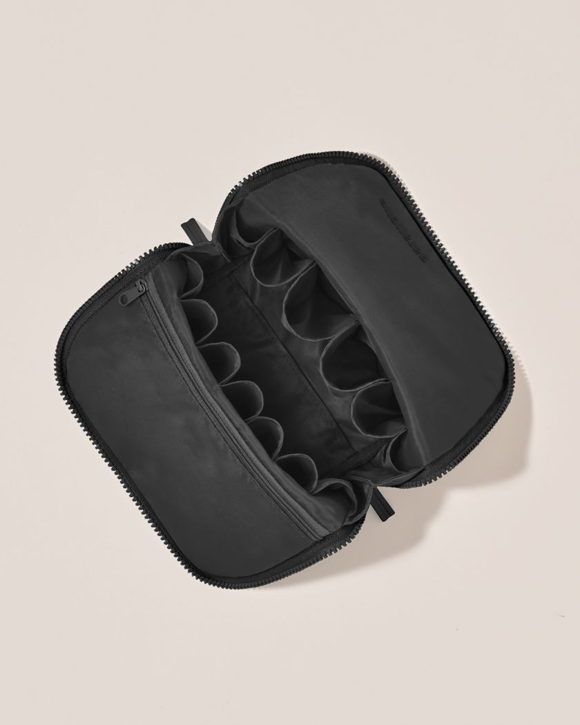 Interior view of Parallelle Onyx (black) Brush Traveller makeup bag showing empty pockets and pouches