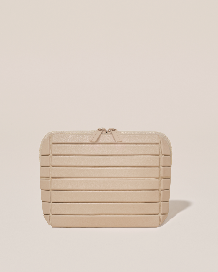 Closed Parallelle Small Bisque (white) Traveller makeup bag with structured horizontal bar design