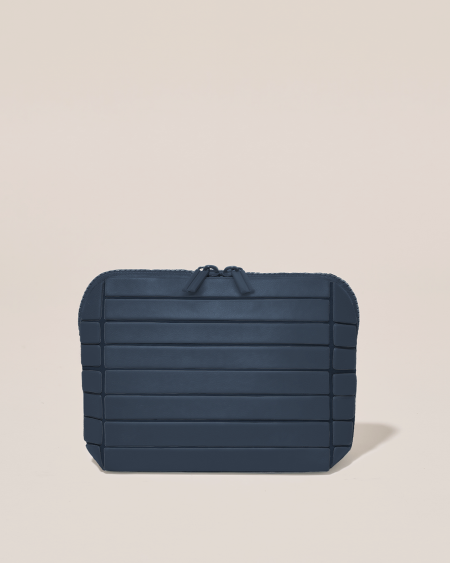 Closed Parallelle Small Indigo (navy) Traveller makeup bag with structured horizontal bar design