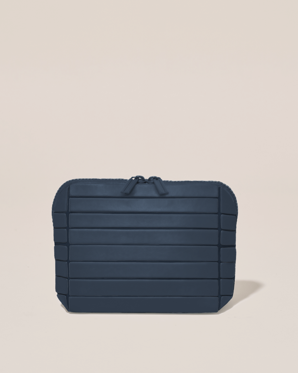 Closed Parallelle Small Indigo (navy) Traveller makeup bag with structured horizontal bar design
