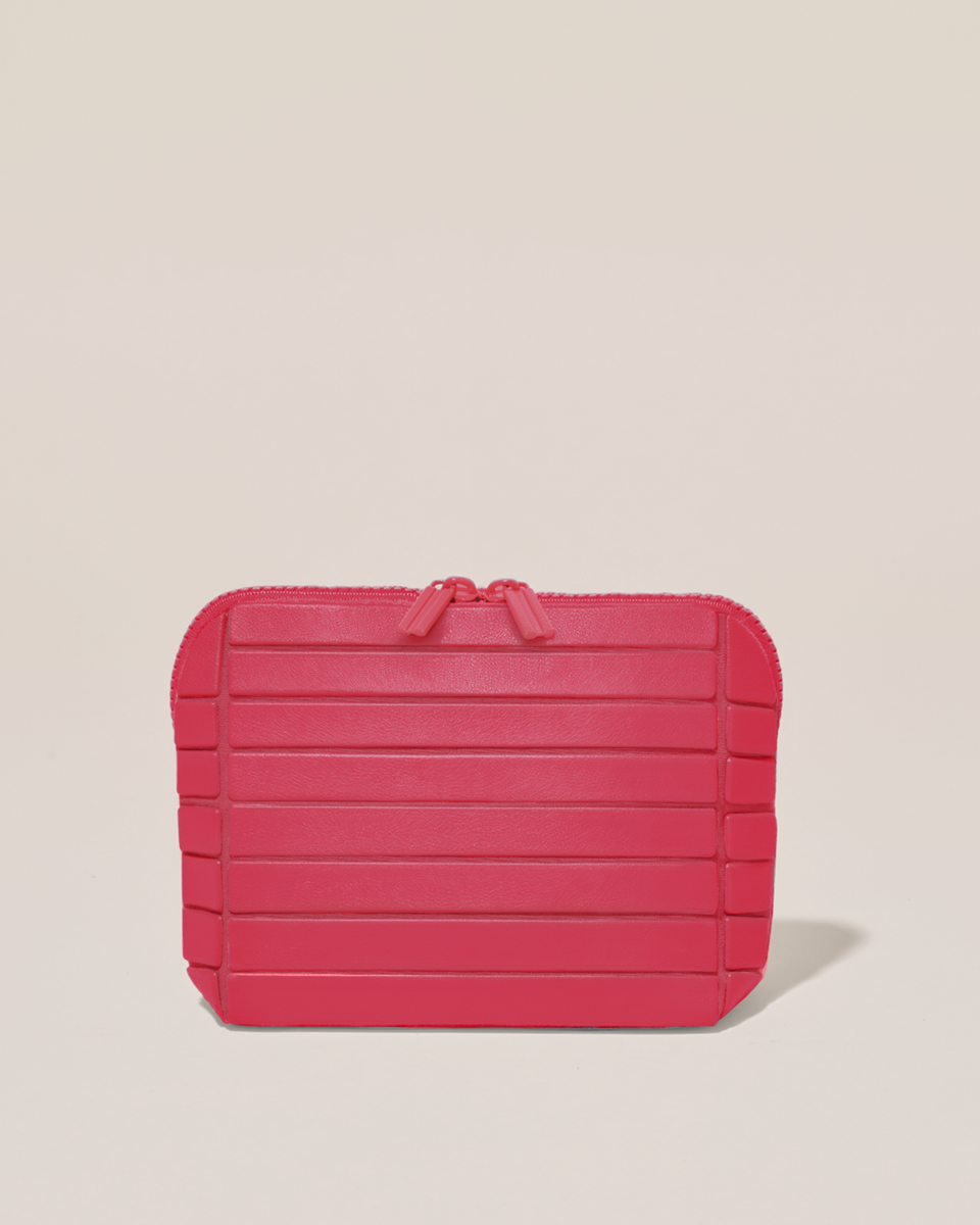 Closed Parallelle Small Tart (hot pink) Traveller makeup bag with structured horizontal bar design