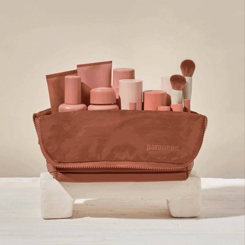 The Large Vicuna Traveller shown folded open, displaying all items inside visibly and upright, with no unpacking required.