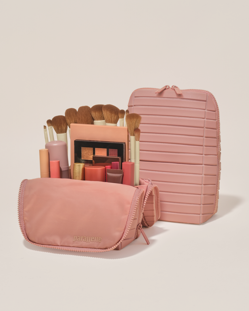 Open and closed Parallelle Blush (pink) Brush Traveller makeup bag showing skincare, brushes, and curated travel essentials