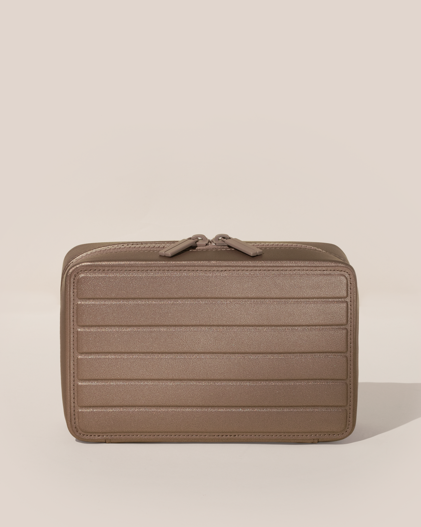 Closed Parallelle Bronze Vault jewelry case with a compact, zip-around design for elevated jewelry organization