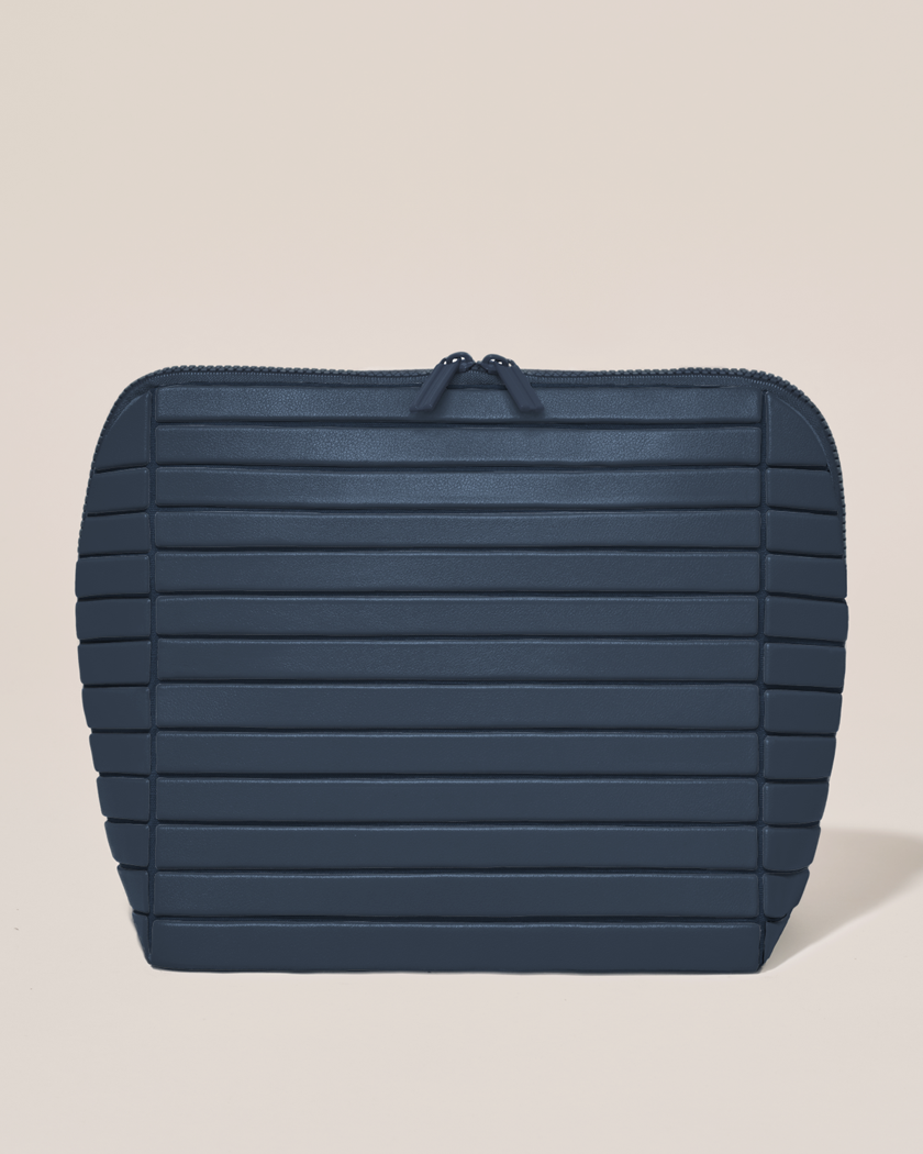 Closed Parallelle Large Indigo (navy) Traveller makeup bag with structured horizontal bar design