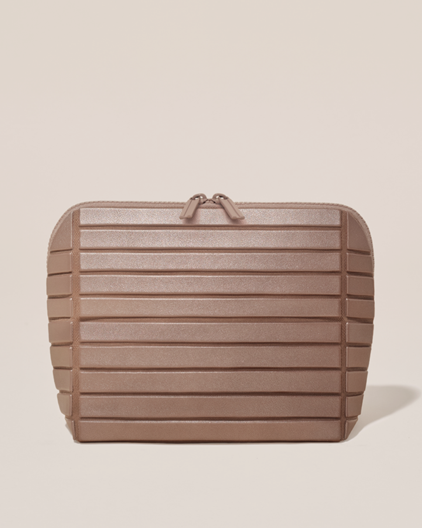 Closed Parallelle Medium Bronze Traveller makeup bag with structured horizontal bar design