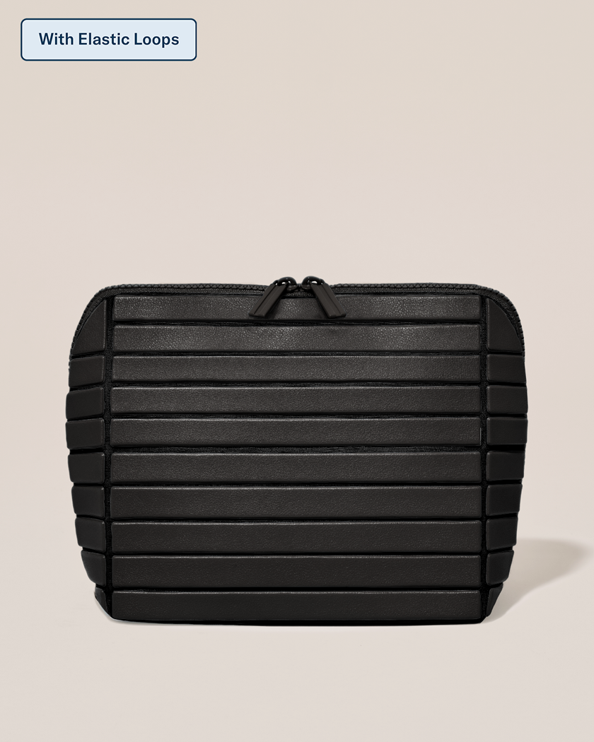 Closed Parallelle Medium Onyx (black) Traveller makeup bag with structured horizontal bar design