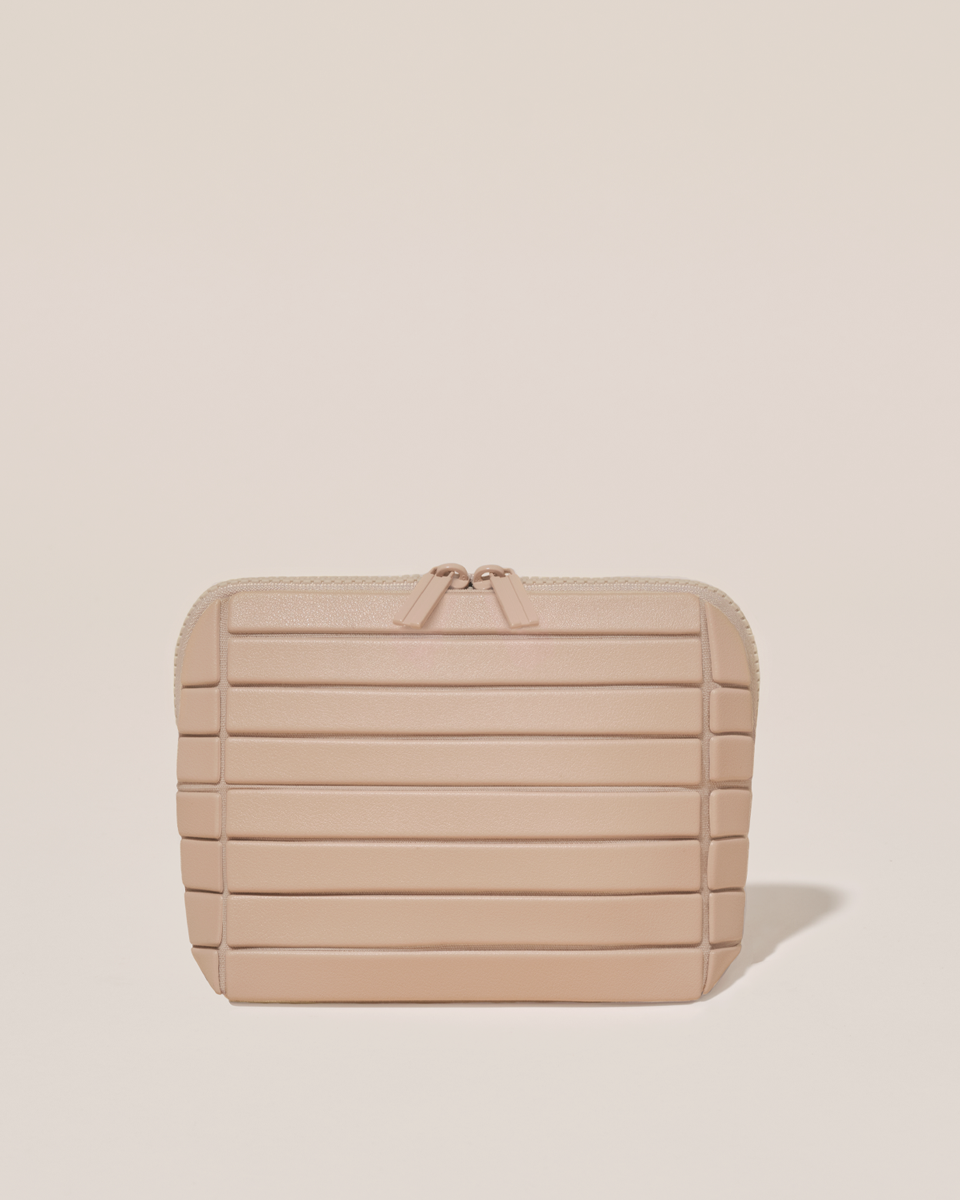 Closed Parallelle Small Bisque (white) Traveller makeup bag with structured horizontal bar design