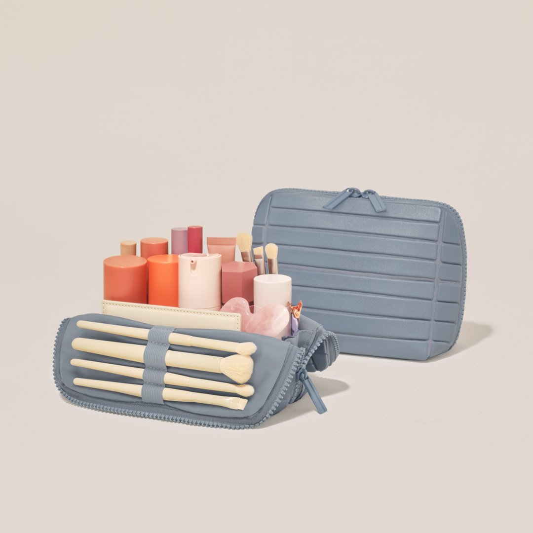 Small Bisque Traveller shown open and closed, packed with tall bottles, skincare, and makeup brushes in elastic loops